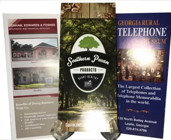 Printed brochures and rack cards displayed on stands